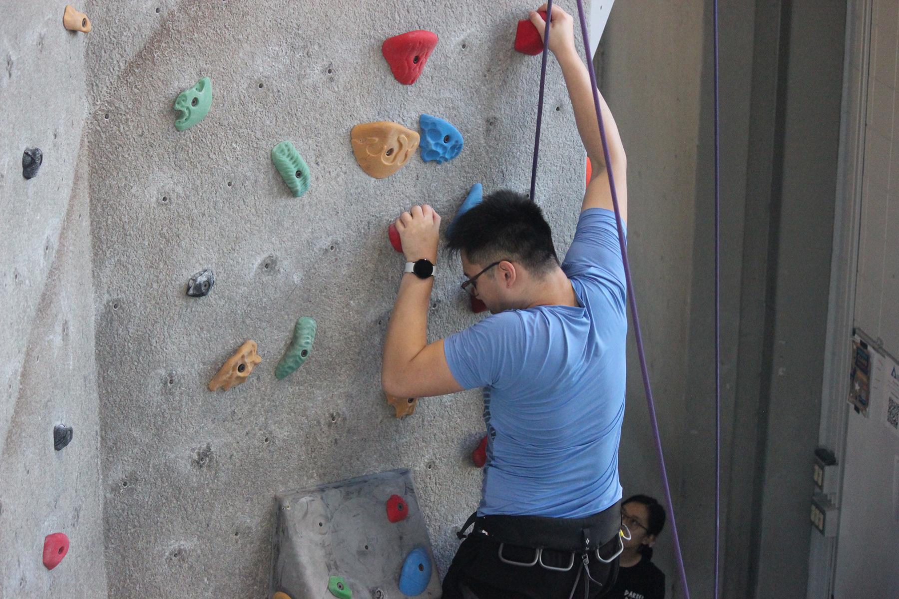 Boy climbing on Wilson Climbing Wall
